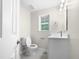 Clean bathroom with white vanity, and a single window at 2200 Wild Apple Ct, Apex, NC 27523