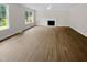 Living room featuring hardwood floors and a fireplace at 2200 Wild Apple Ct, Apex, NC 27523