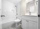 Bathroom with white vanity, tile shower, and a toilet at 2200 Wild Apple Ct, Apex, NC 27523