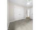 Spacious bedroom with double doors and carpet flooring at 2200 Wild Apple Ct, Apex, NC 27523