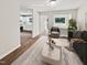 Virtually staged living room featuring a neutral color palette and modern furniture at 1421 Athens Dr, Raleigh, NC 27606
