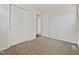 Spacious bedroom with neutral walls, carpet flooring, and a double-door closet at 1421 Athens Dr, Raleigh, NC 27606