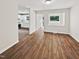 Bright living room with hardwood floors and an open concept floor plan at 1421 Athens Dr, Raleigh, NC 27606