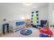 Charming Bedroom with crib, rocker, and toys at 135 Deep Creek, Rougemont, NC 27572