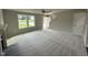 Spacious living room with carpeted floors, fireplace, and large windows at 153 Wynd Crest Way, Benson, NC 27504