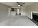 Spacious living room with kitchen and fireplace views at 153 Wynd Crest Way, Benson, NC 27504