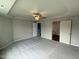 Main bedroom with ceiling fan and access to bathroom at 153 Wynd Crest Way, Benson, NC 27504