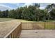 Wooden deck overlooking wooded backyard at 153 Wynd Crest Way, Benson, NC 27504