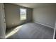 Well-lit bedroom featuring neutral walls and carpet at 153 Wynd Crest Way, Benson, NC 27504