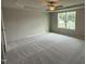 Large bedroom with ceiling fan and carpet flooring at 153 Wynd Crest Way, Benson, NC 27504