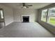 Bright living room featuring a fireplace and carpet at 153 Wynd Crest Way, Benson, NC 27504