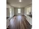 Spacious dining room with wood flooring and kitchen access at 153 Wynd Crest Way, Benson, NC 27504