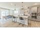 Eat-in kitchen with island seating and view to backyard at 2124 Curry Meadow Way, Durham, NC 27703