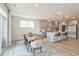 Light and airy dining room with hardwood floors and access to patio at 2124 Curry Meadow Way, Durham, NC 27703