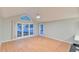 Spacious living room features hardwood floors, vaulted ceilings, and large windows at 128 Dixie Dr, Chapel Hill, NC 27514