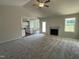 Open concept living room with vaulted ceilings and kitchen view at 66 Tulipfield Way, Benson, NC 27504