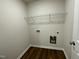 Laundry room with wire shelving and space for washer and dryer at 66 Tulipfield Way, Benson, NC 27504