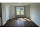 Bright spare bedroom with hardwood floors and large windows at 66 Tulipfield Way, Benson, NC 27504