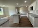 Open concept kitchen with island, granite countertops and view to living room at 66 Tulipfield Way, Benson, NC 27504