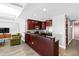 Modern kitchen with dark wood cabinetry and granite counters at 122 N Harrington St # 1215, Raleigh, NC 27603