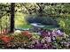 Golf course surrounded by lush azaleas and tranquil natural beauty at 143 Traceway N, Sanford, NC 27332