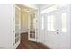 Elegant entryway with hardwood floors and French doors leading to an office at 143 Traceway N, Sanford, NC 27332