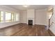 Spacious living room featuring hardwood floors and a fireplace at 143 Traceway N, Sanford, NC 27332