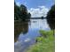 Serene lake view with a person kayaking, offering a peaceful waterfront setting at 143 Traceway N, Sanford, NC 27332