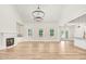 Spacious living room with hardwood floors, fireplace, and built-in shelving at 4155 Us-421, Lillington, NC 27546
