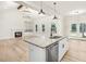 Open concept kitchen with granite island, stainless steel appliances, and hardwood floors at 4155 Us-421, Lillington, NC 27546