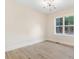 Bright bedroom with hardwood floors and a large window at 4155 Us-421, Lillington, NC 27546
