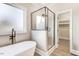 Modern bathroom featuring a soaking tub, walk-in shower, and stylish vanity at 4155 Us-421, Lillington, NC 27546
