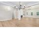 Bright dining room featuring hardwood floors and a modern chandelier at 4155 Us-421, Lillington, NC 27546