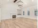 Bright living room with hardwood floors, fireplace, and large windows at 4155 Us-421, Lillington, NC 27546