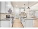 Modern kitchen with white cabinets, granite countertops and stainless steel appliances at 4155 Us-421, Lillington, NC 27546