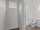 Convenient half bathroom with shiplap walls and wood-look flooring at 28 Pepper Ln, Garner, NC 27529