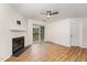 Living room with LVP flooring, fireplace and sliding glass doors to deck at 3706 Chimney Ridge Pl # 201, Durham, NC 27713