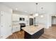 Modern kitchen features white cabinets, granite countertops, and an island at 108 Ascot, Rocky Mount, NC 27804
