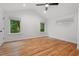 Large main bedroom with hardwood floors, vaulted ceiling, and ample natural light at 2114 Woodview Dr, Raleigh, NC 27604