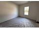 Simple bedroom with carpeted floors and a window at 64 Lupin Dr, Smithfield, NC 27577