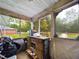 Screened porch overlooking backyard and trees at 209 Privettes Hedge Rd, Rocky Mount, NC 27801