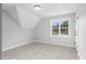 Bright bedroom with sloped ceiling, carpet, and window at 440 Somerset Way, Rocky Mount, NC 27804