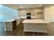 Modern kitchen with stainless steel appliances and an island at 824 Putney Hill Rd, Zebulon, NC 27597