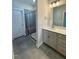 Bathroom with a walk-in shower and double vanity at 824 Putney Hill Rd, Zebulon, NC 27597
