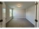 Bright bedroom with neutral carpeting and large window at 824 Putney Hill Rd, Zebulon, NC 27597