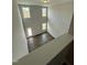 High-ceiling living room with hardwood floors and multiple windows at 824 Putney Hill Rd, Zebulon, NC 27597