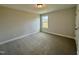 Bright bedroom with neutral walls and carpet at 824 Putney Hill Rd, Zebulon, NC 27597