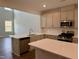 Modern kitchen with stainless steel appliances and an island at 824 Putney Hill Rd, Zebulon, NC 27597