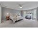 Main bedroom with bay window, plush carpet, and sitting area at 6 Placid Ct, Durham, NC 27713