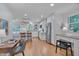 Open concept kitchen with an island, white cabinets and built in desk at 6 Placid Ct, Durham, NC 27713